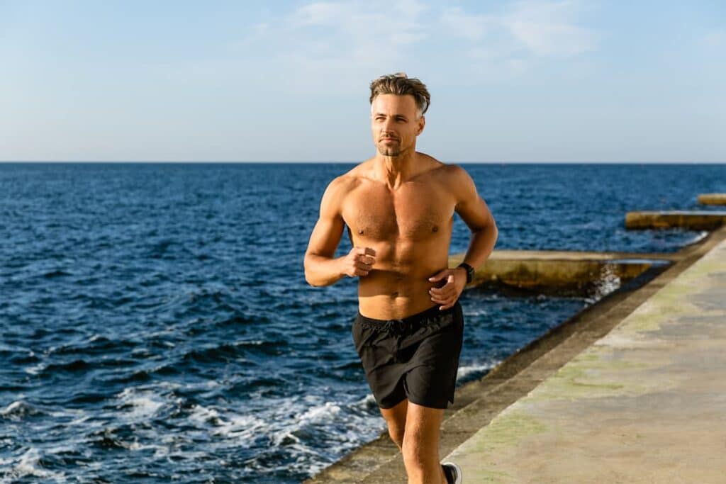 Peptide Therapy Treatments - Middle aged man running on a pier